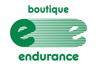 Logo of Boutique Endurance featuring a stylized green "e" on a striped background with the words "Boutique" and "Endurance" in green text above and below the image respectively, subtly nodding to our roots at Kilomaîtres LaSalle.